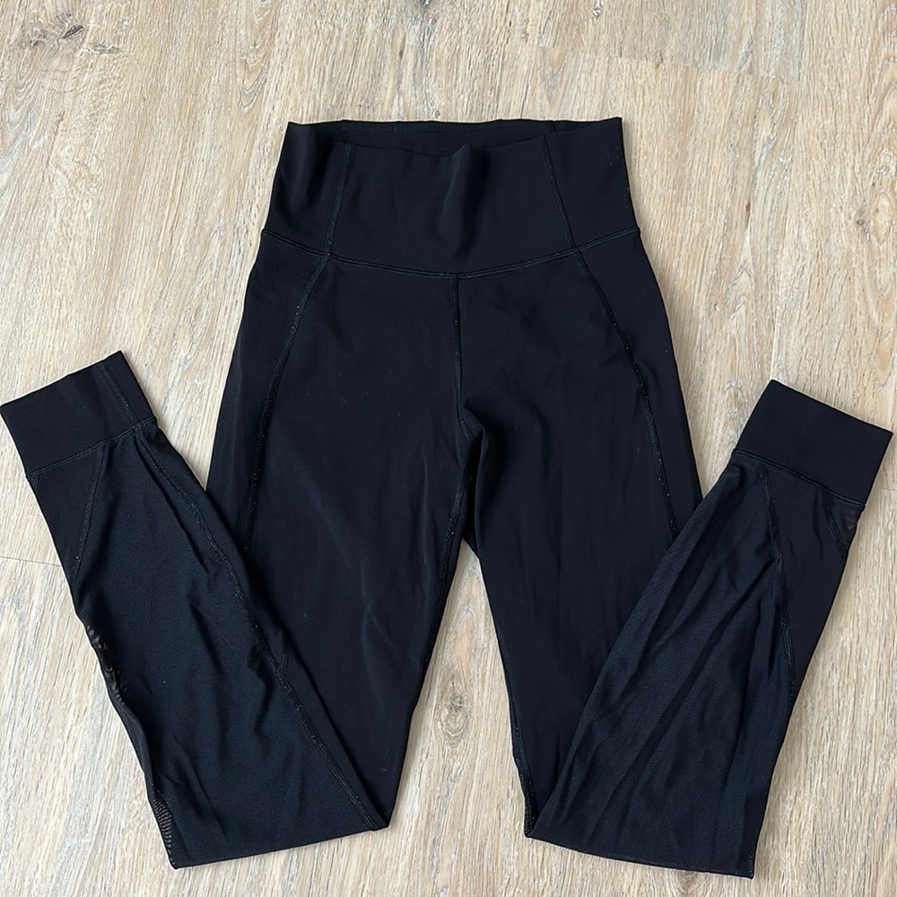 Lululemon black mesh detailed leggings- Size 6. Great condition.
